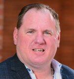 a man smiling for the camera