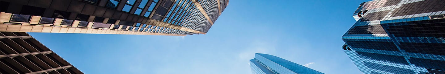 looking up at tall buildings