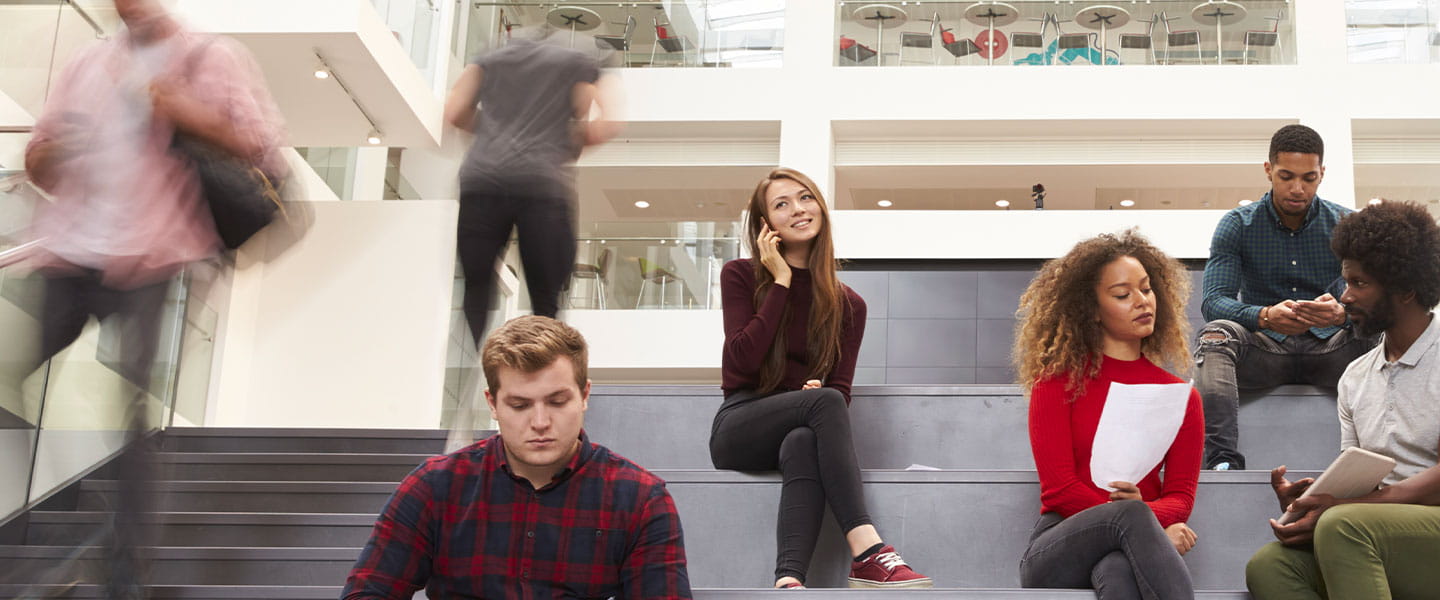 a group of people sitting on a bench