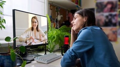 a person looking at a computer screen a person looking at a computer screen