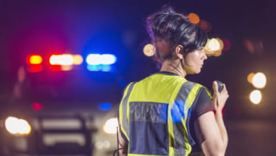 A policewoman at night