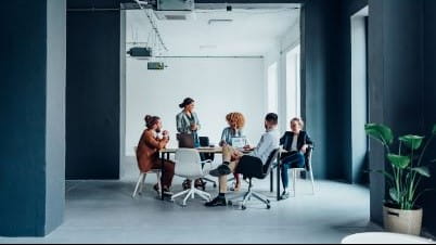 a group of people sitting in chairs