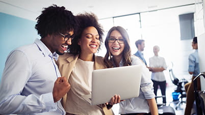 Students looking at laptop together