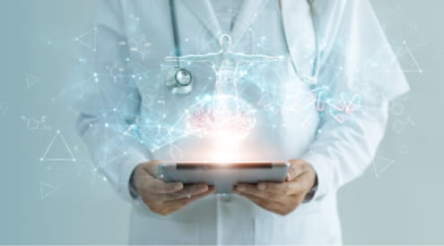 A doctor holding an iPad