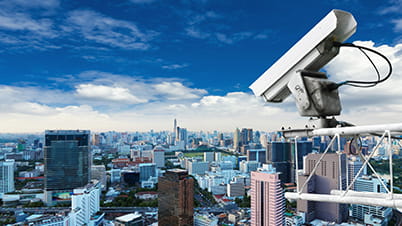 Video surveillance camera overlooking a city landscape Video surveillance camera overlooking a city landscape
