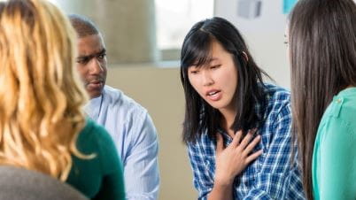 a person talking to a group of people a person talking to a group of people