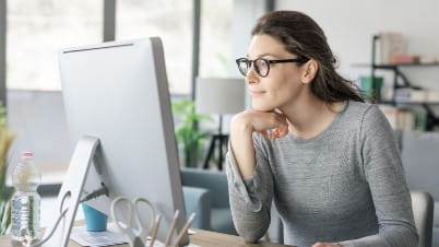 Navigating the digital workplace main image a woman sitting at a desk