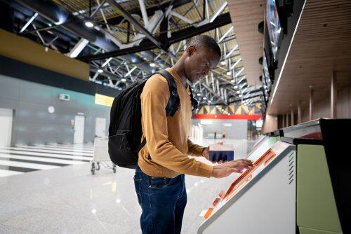 Passenger using self check-in kiosk for blog post