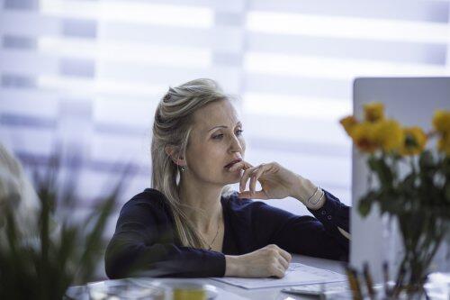 Pensive female IT director for blog post