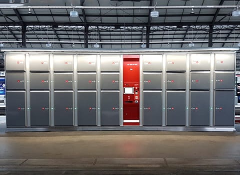 a large room with a large group of metal lockers