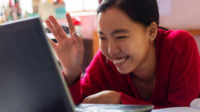 a person smiling and holding the hand up a person smiling and holding the hand up