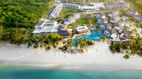 Aerial view of beachfront resort with multiple buildings