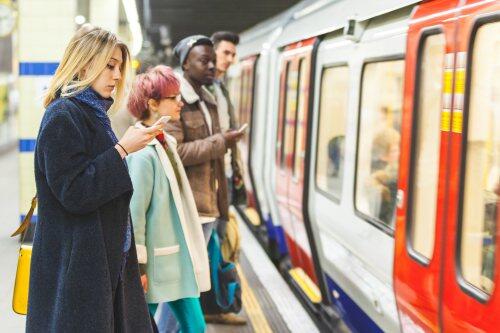 Rail passengers waiting on a platform for blog post