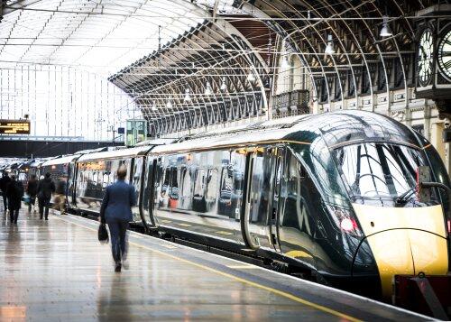 Man walking on train platform for blog post